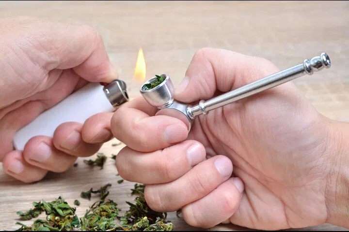 lighting a hash pipe
