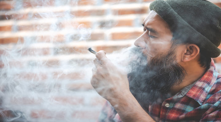 man smoking joint
